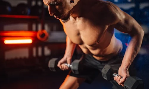 man-doing-exercise-with-light-weights-during-the-t-2026-01-09-09-39-27-utc
